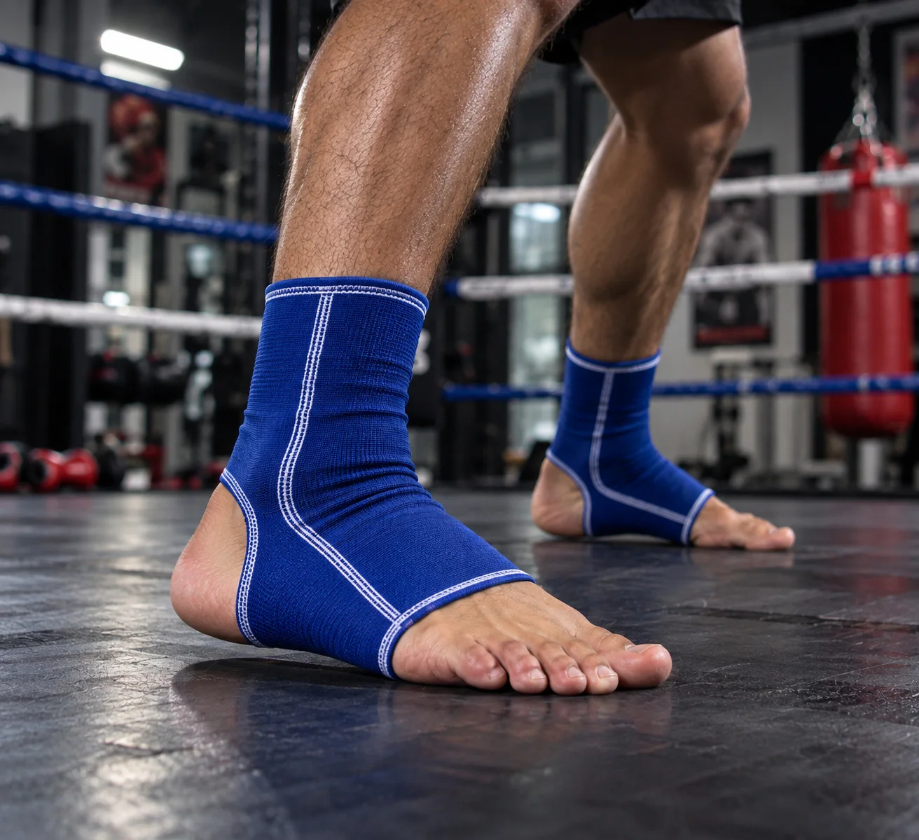 Blue ankle supports shown in boxing ring training setting