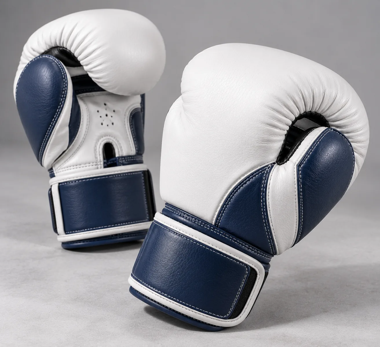 White and navy boxing gloves clean manufacturer catalog product photo