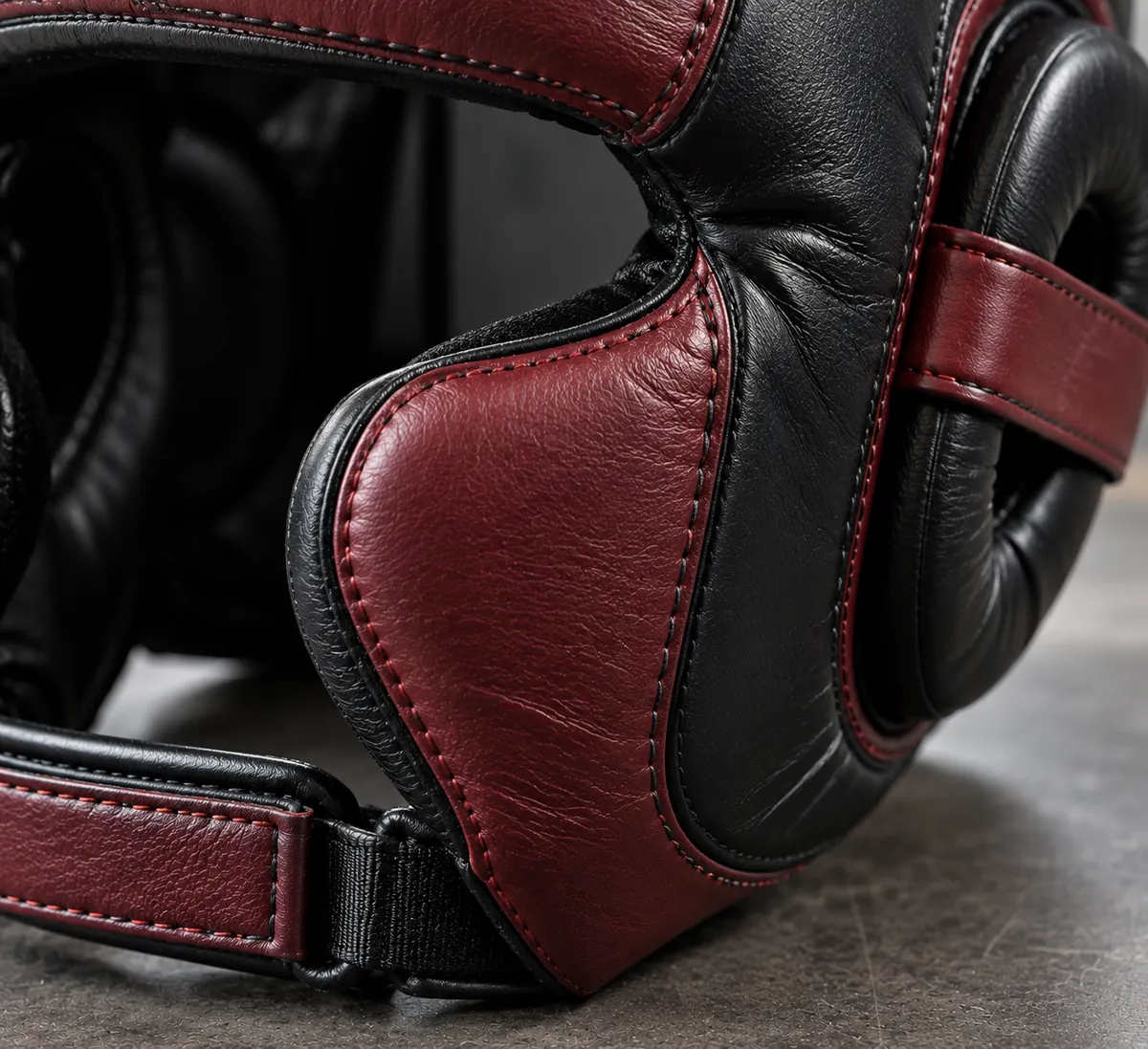 Close-up of boxing headgear outer material, padding and stitched trim