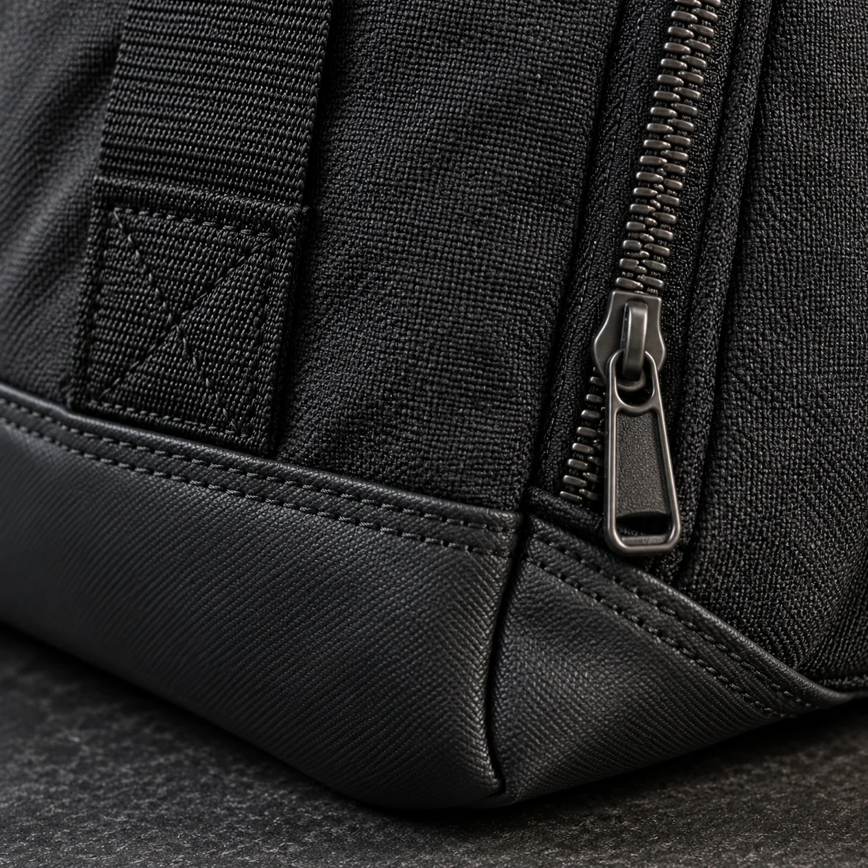 Close-up detail of zipper and stitching on black training bag