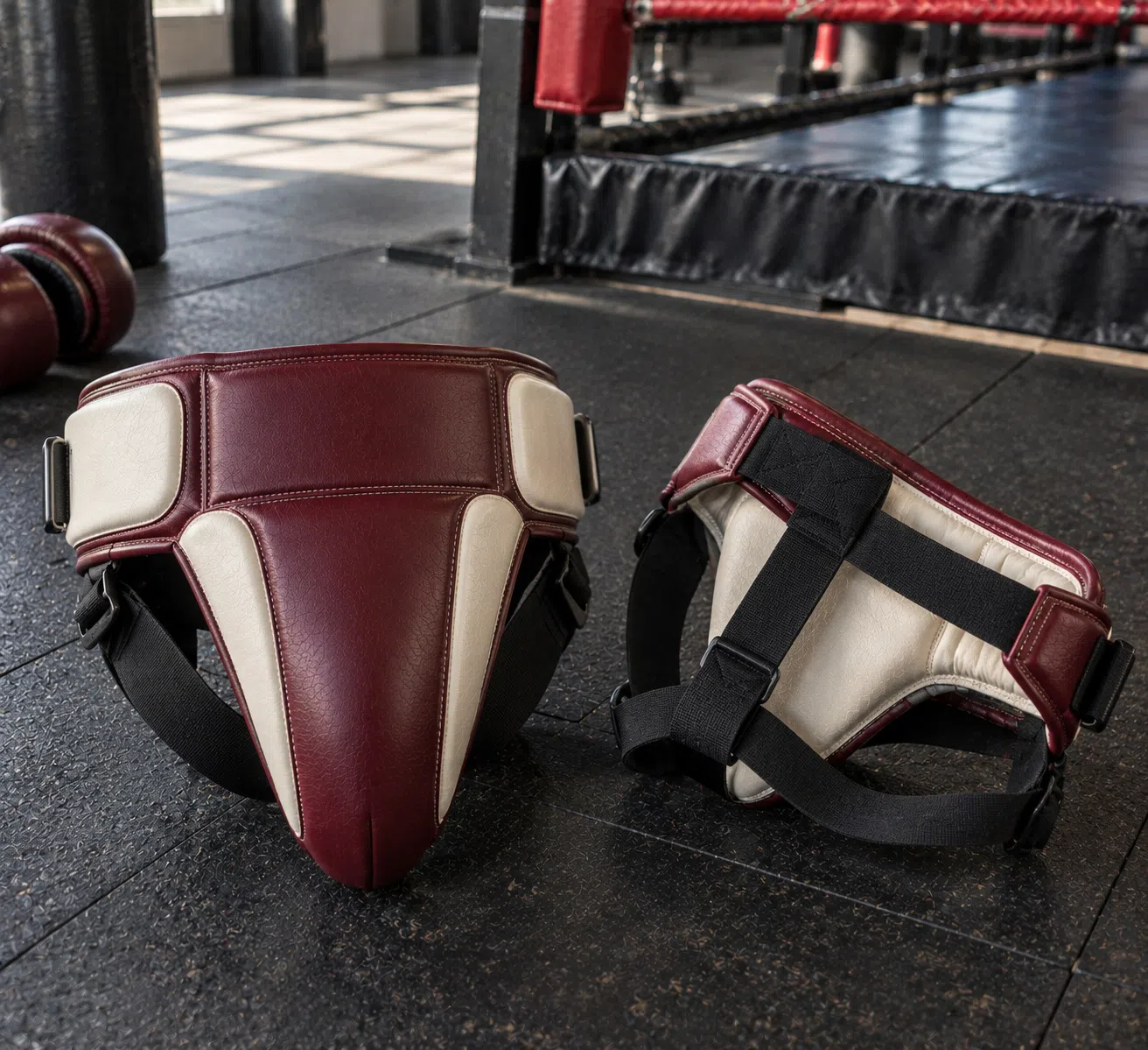 Burgundy groin guard shown with back and side views