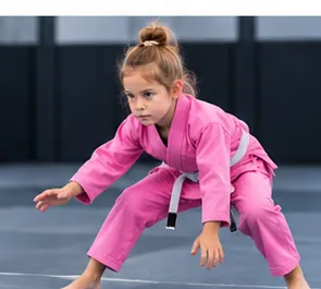 Child in a pink kids BJJ gi