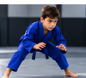 Child training in a blue kids BJJ gi